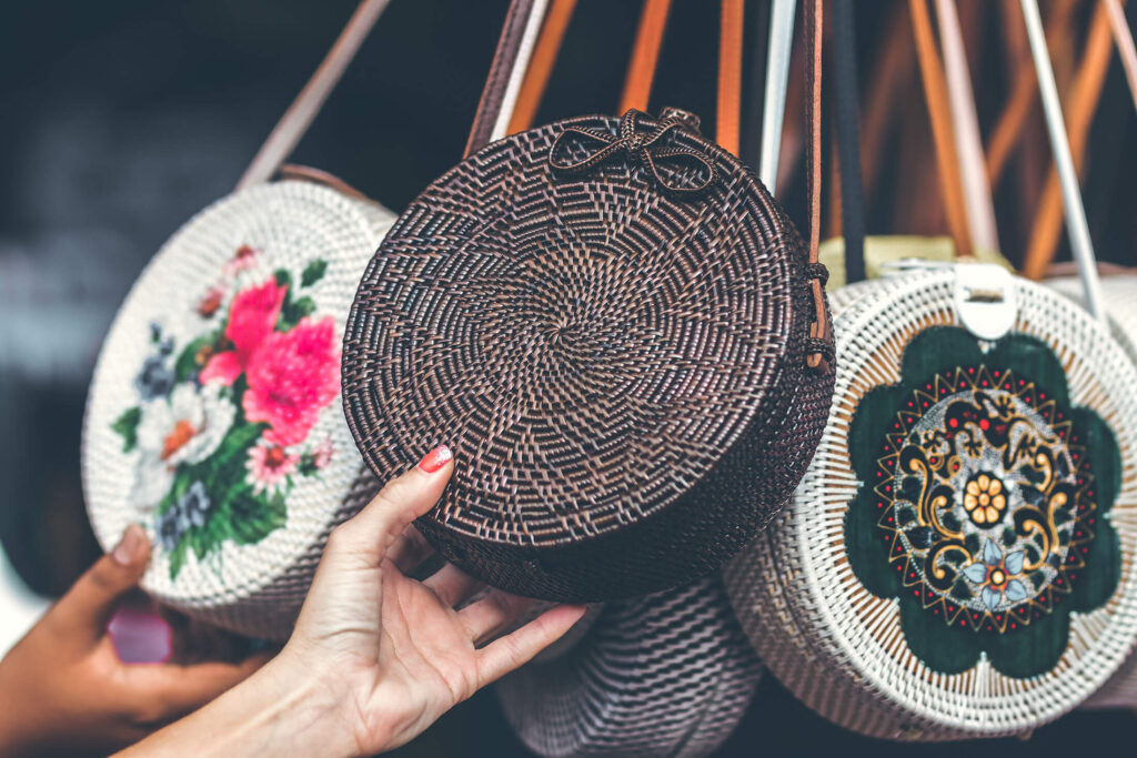 Circular handicraft woven handbags with a strap