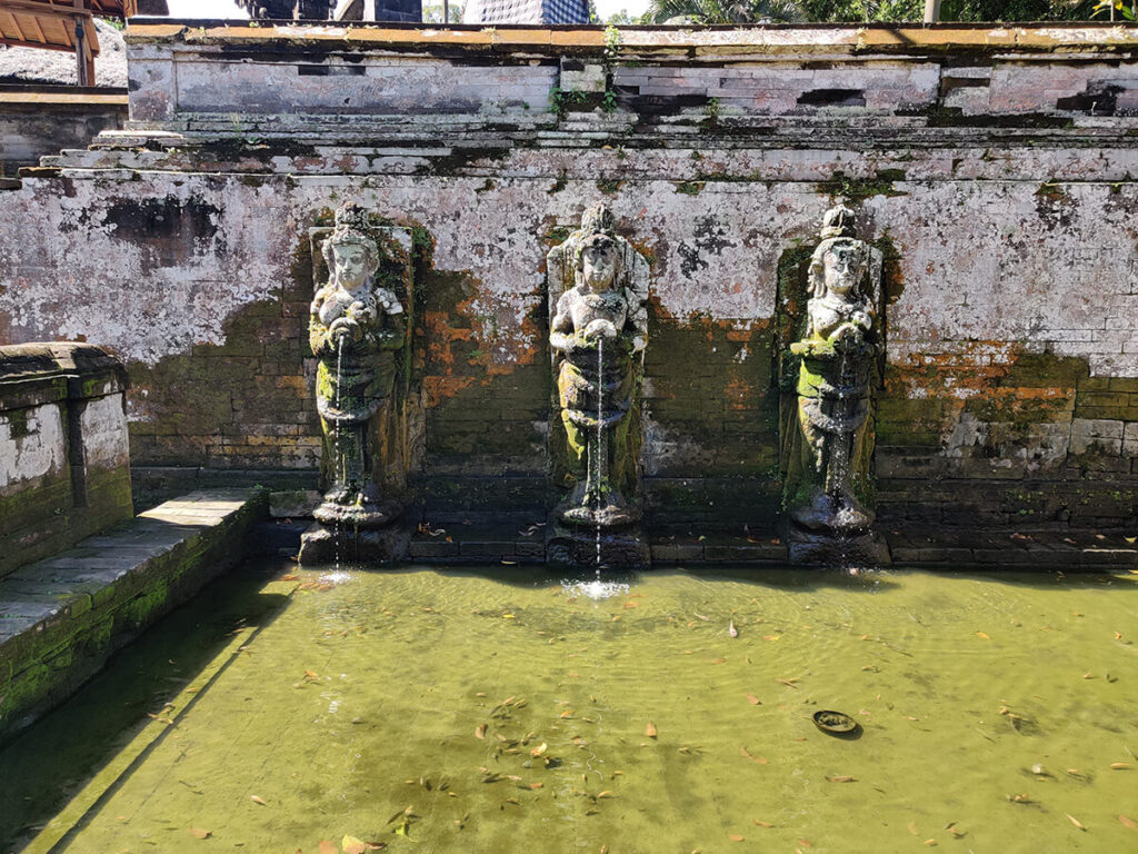 Carved statues in a bathing fountain