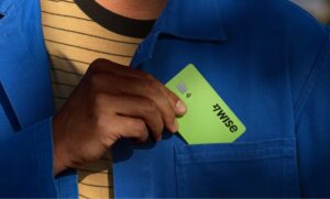 Wise card in top pocket of blue shirt