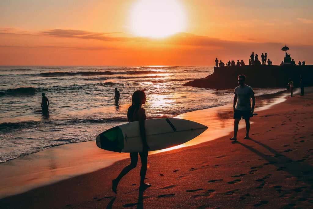 Echo Beach surfers at sunset